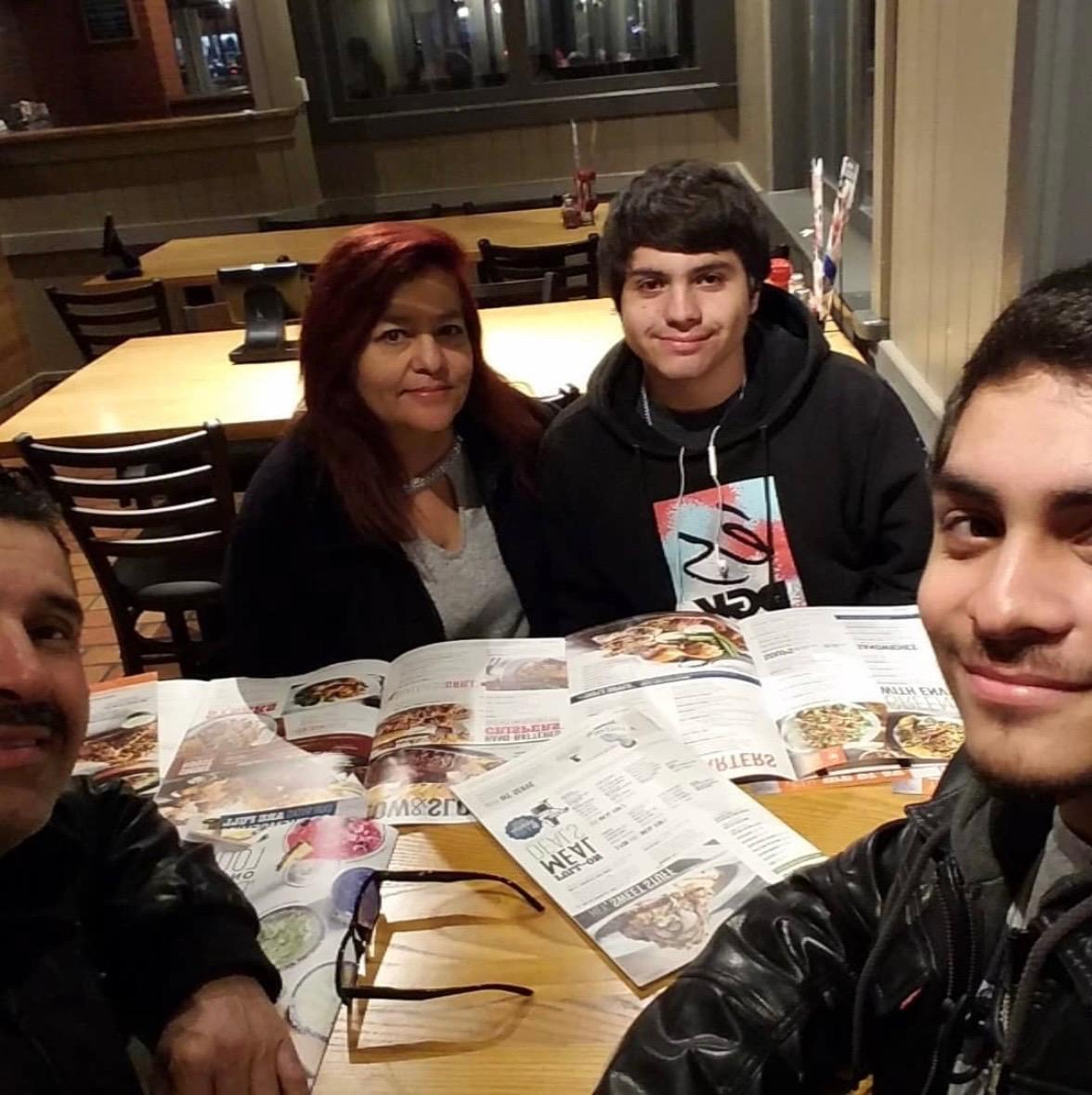 Andres Rabago with his mom and family